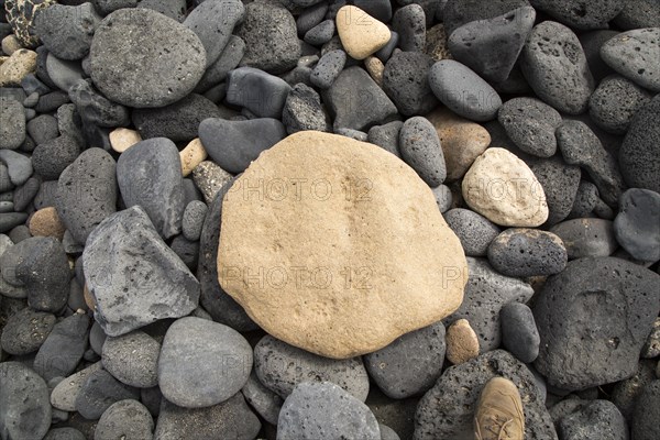 Close up of rounded beach pebbles looking down from above, Isla La Graciosa, Lanzarote, Canary