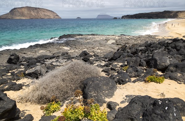 Montana Clara island nature reserve and sandy beach Playa de las Conchas, Graciosa island,