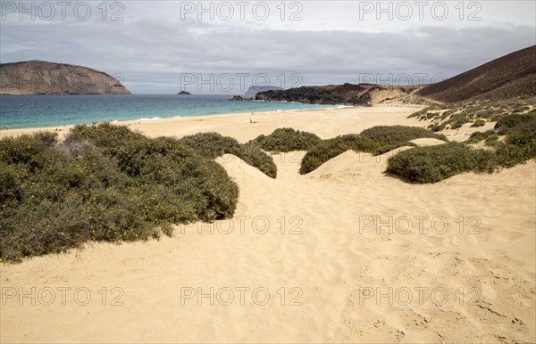 Montana Clara island nature reserve and sandy beach Playa de las Conchas, Graciosa island,