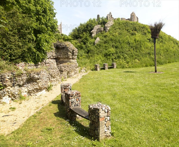 Norman motte and bailey castle with Victorian building ruin Eye, Suffolk, England, UK