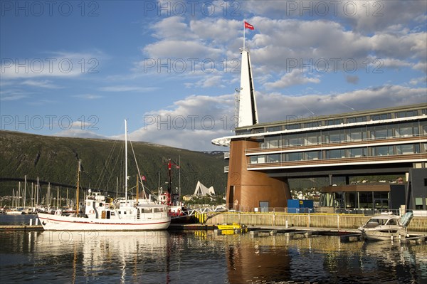 Modern architecture of Scandic Hotel and boats in harbour, city centre of Tromso, Norway, Europe