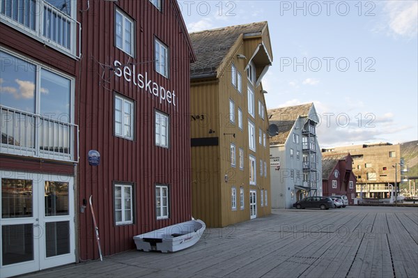 Waterside old warehouse wooden buildings harbour area, Tromso, Norway, Europe
