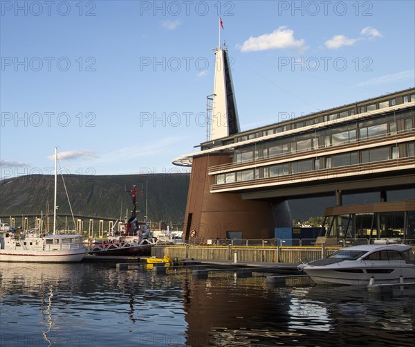 Modern architecture of Scandic Hotel and boats in harbour, city centre of Tromso, Norway, Europe