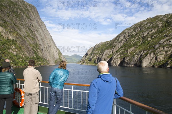 Tourists sightseeing from Hurtugruten ship, Trollfjorden, Lofoten Islands, Nordland, northern,