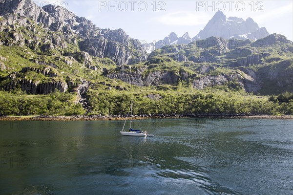 Steep sided glacial trough fiord jagged mountain peaks, Trollfjorden, Lofoten Islands, Nordland,