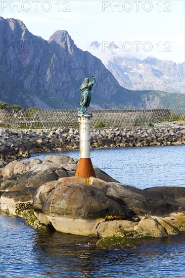 Fisherman's wife statue at harbour entrance, Svolvaer, Lofoten Islands, Nordland, Norway, Europe