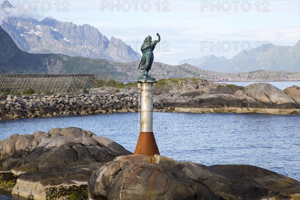 Fisherman's wife statue at harbour entrance, Svolvaer, Lofoten Islands, Nordland, Norway, Europe