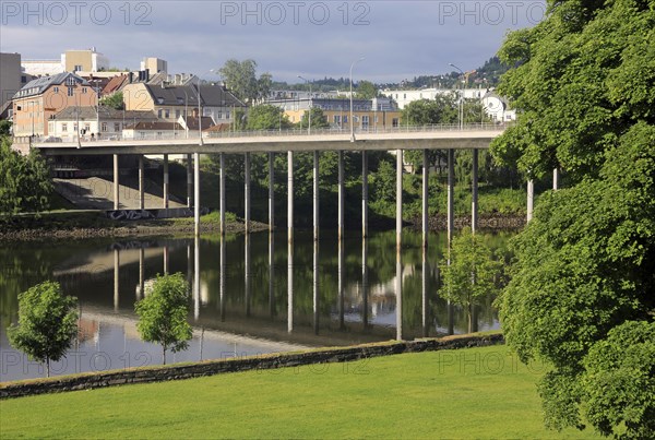 Elgeseter Bridge reflected in water of Nidelva river, Trondheim, Norway, Europe