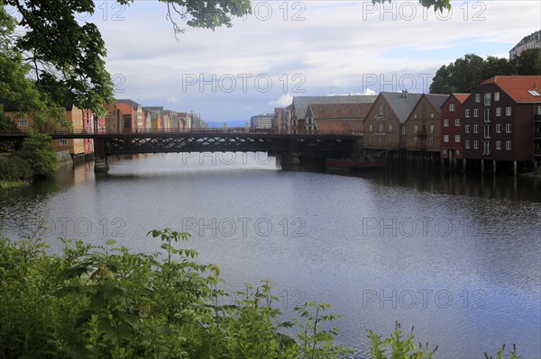 Historic waterside warehouse buildings on River Nidelva, Bryggene, Trondheim, Norway, Europe