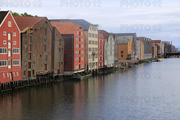 Historic waterside warehouse buildings on River Nidelva, Bryggene, Trondheim, Norway, Europe