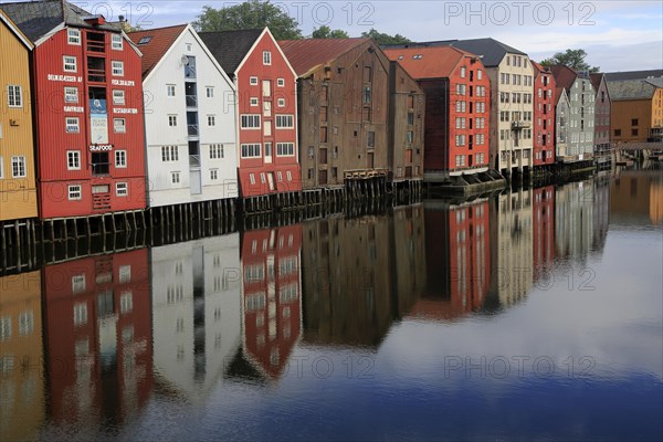 Historic waterside warehouse buildings on River Nidelva, Bryggene, Trondheim, Norway, Europe