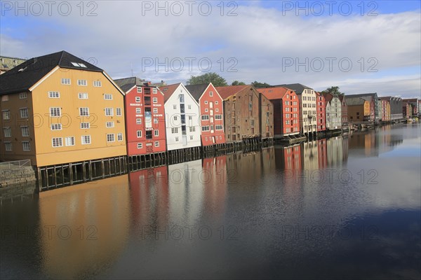 Historic waterside warehouse buildings on River Nidelva, Bryggene, Trondheim, Norway, Europe