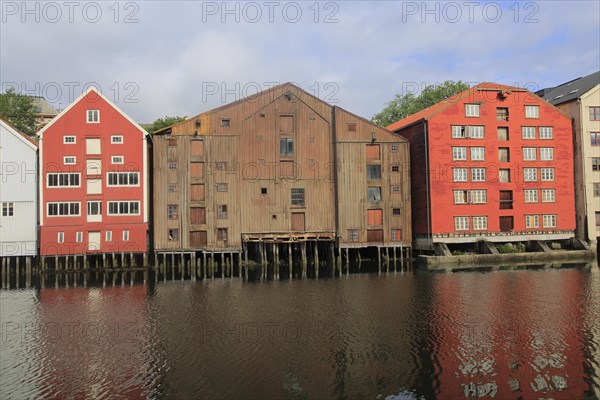 Historic waterside warehouse buildings on River Nidelva, Bryggene, Trondheim, Norway, Europe
