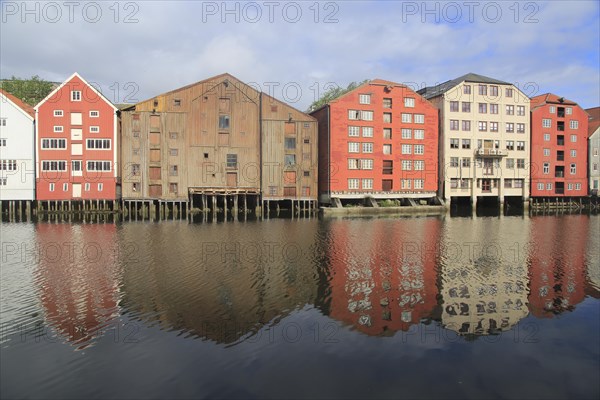 Historic waterside warehouse buildings on River Nidelva, Bryggene, Trondheim, Norway, Europe