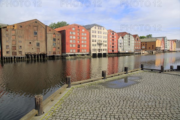 Historic waterside warehouse buildings on River Nidelva, Bryggene, Trondheim, Norway, Europe
