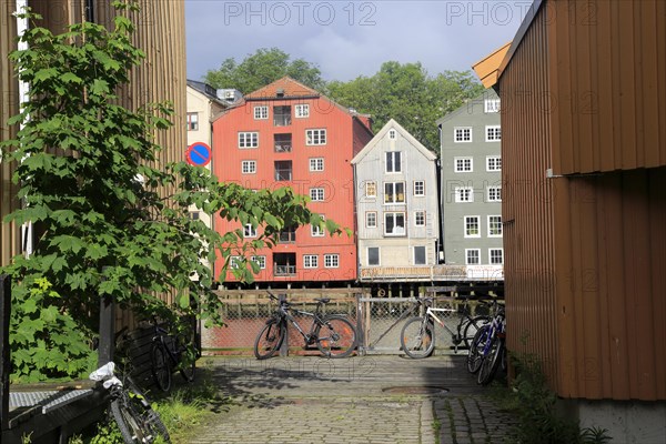 Historic waterside warehouse buildings on River Nidelva, Bryggene, Trondheim, Norway, Europe