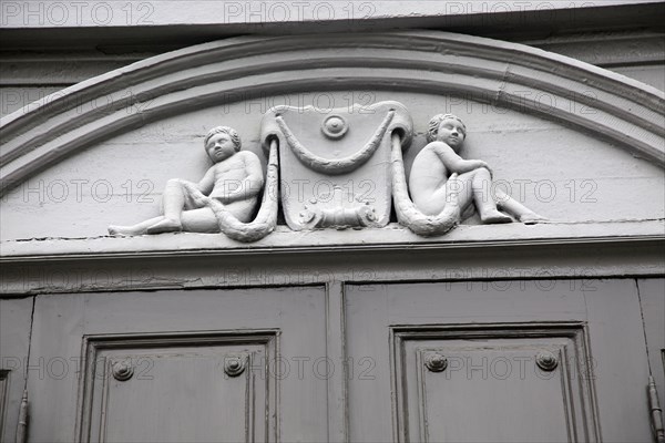 Details of cherub carvings, Stiftsgarden palace in city of Trondheim, Norway, Europe