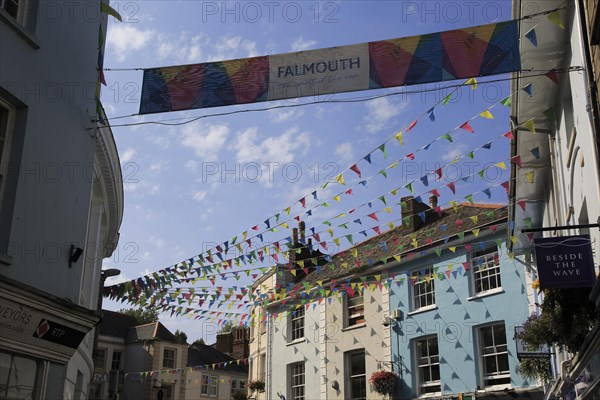 Bunting flags flying in street of town centre, Falmouth, Cornwall, England, UK