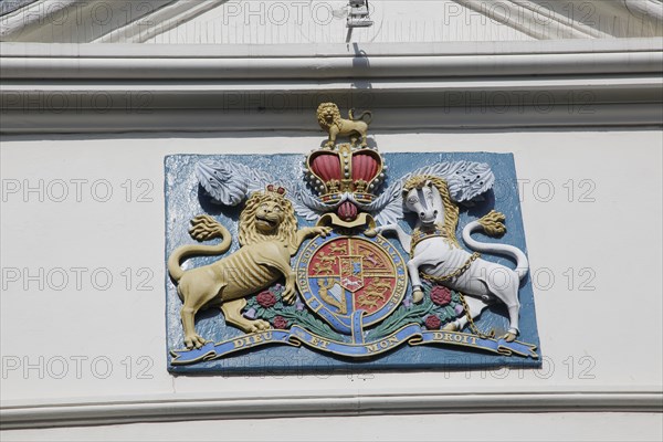 Lion and unicorn royal coat of arms 'Dieu et mon Droit' motto of monarchy seen in Falmouth,
