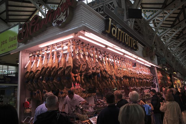 Ham jamon meat stall inside central market building, city of Valencia, Spain, Europe