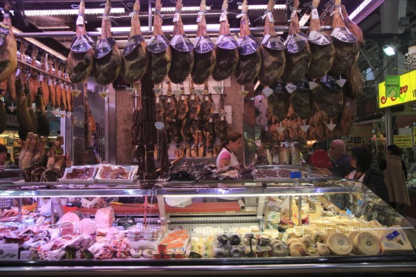 Ham jamon meat stall inside central market building, city of Valencia, Spain, Europe