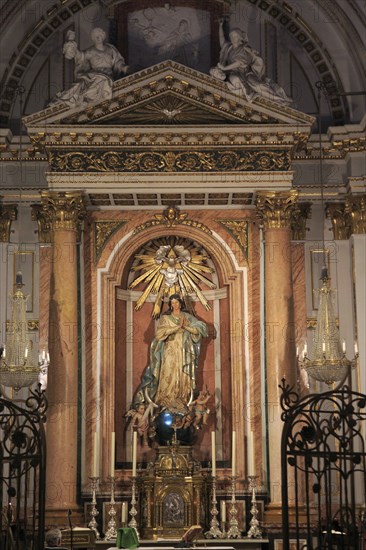 Altar statue ornately decorated inside cathedral church building building, city of Valencia, Spain,