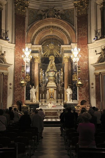Catholic mass priest at altar in cathedral church, city of Valencia, Spain, Europe