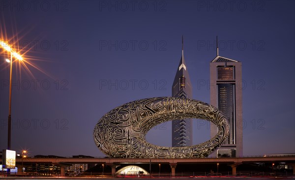 Night shot, entrance, Museum of the Future, behind Jumeirah Emirates Towers, skyscrapers,