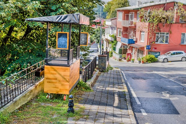 Vendor cart beside fence next to road on Princess Island in Istanbul, Türkiye