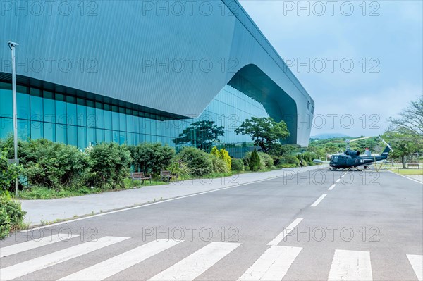 Military helicopter on road in front of aeronautics museum in Jeju, South Korea, Asia