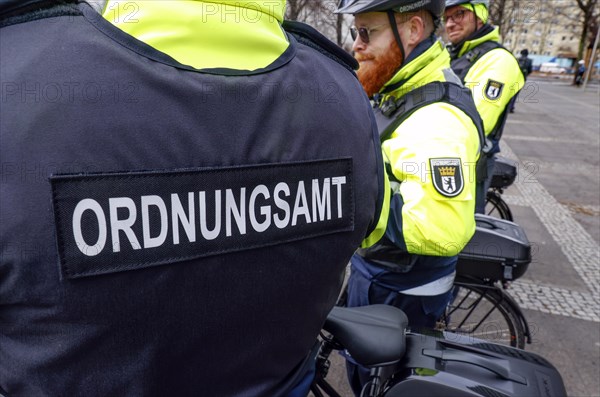 Employees of the public order office's bicycle squadron with their bikes and protective clothing.