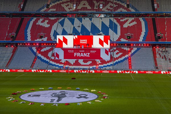 Banner with Franz Beckenbauer and flower wreaths, behind the speaker's stage at the end of the