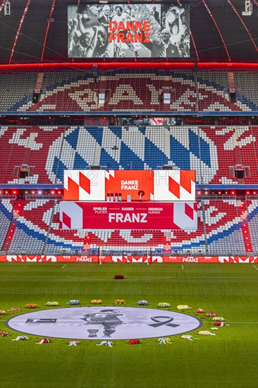 Banner with Franz Beckenbauer and wreaths of flowers, behind the speaker's stage at the end of the