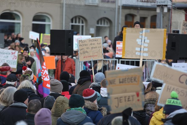 A set of anti AFD signs held high by members of the crowd during a demonstration against the AFD