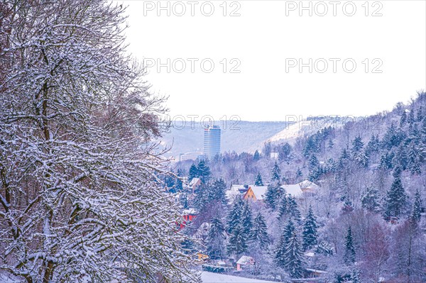 View of the snow-covered Jentower in Jena with mountains and forests in the background, Jena,