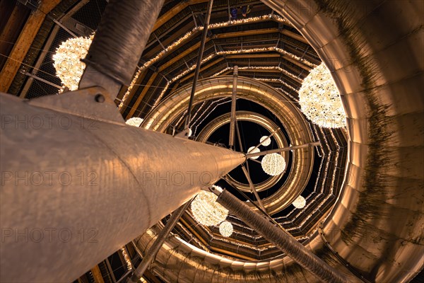 View upwards through a spiral-shaped wooden structure with light spheres, magical forest dwellers,