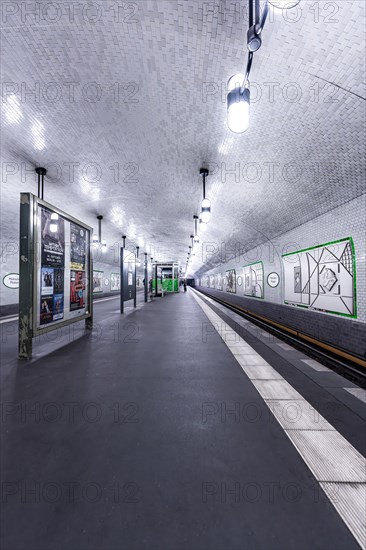 Empty underground station with white tiles and modern design under clear light, Märkisches Museum,