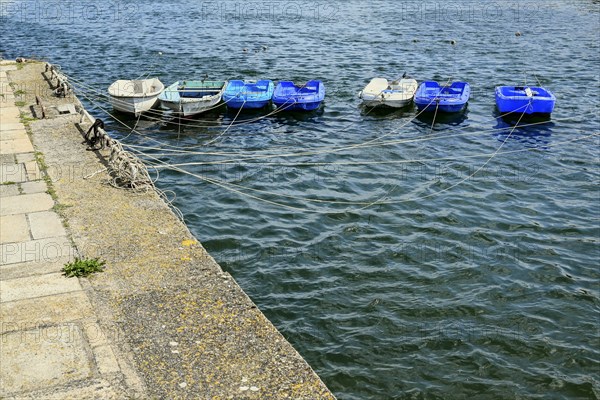 Row of small boats in the harbour basin, Concarneau, Finistère, Brittany, France, Europe