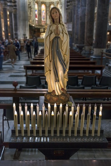 Electric candles in front of a Madonna in the Cathedral of San Lorenzo, Piazza San Lorenzo, Genoa,