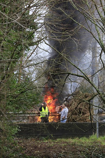 Farmers with tractors, craftsmen with vans and lorry drivers block the closed bridge Pont de