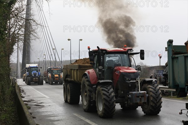 Farmers with tractors, craftsmen with vans and lorry drivers block the closed bridge Pont de