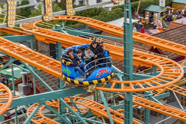Roller coaster Crazy Mouse, winding tracks and carriages of the railway, rails, fairground ride at