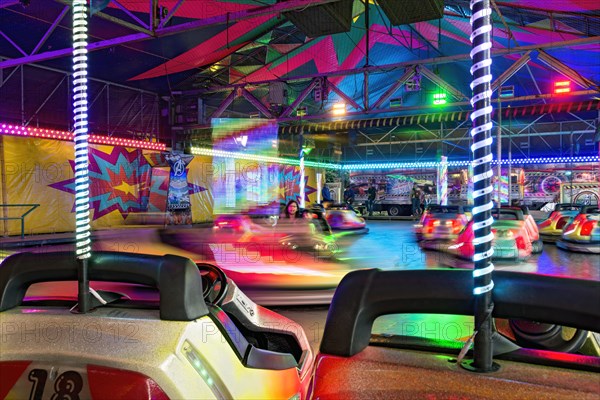 Autoscooter speedway, autodrome, bumper cars, electric cars with colourful lighting, fairground