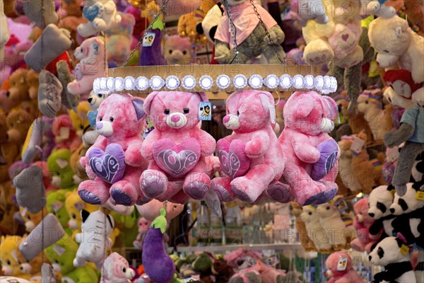 Pink teddy bears, cuddly toys with hearts, dolls, prizes, raffle prizes, lucky draw, lottery stand,