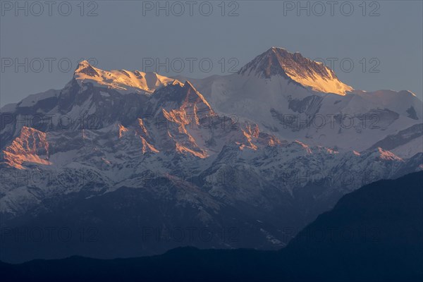Annapurna II (7937m) and Annapurna IV (7525m, left) mountain peaks seen at sunrise on a clear