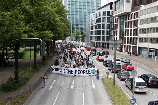 Demonstrators hold a banner with the inscription Power to the people at the alliance demo on