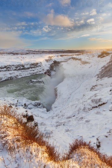 Gullfoss waterfall in the snow in winter located in the canyon of Hvítá river, Haukadalur,