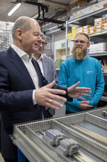 Federal Chancellor Olaf Scholz, SPD, visits the company ST Gebäudetechnik in Potsdam. Here in