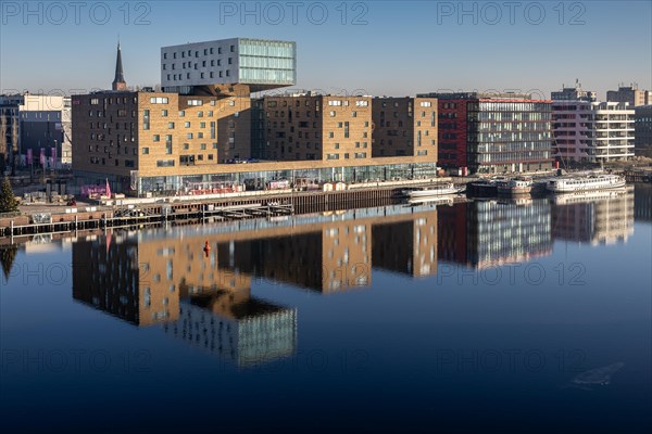 Design hotel nhow, next to Coca-Cola Germany in a red building, reflection of the Spree, former