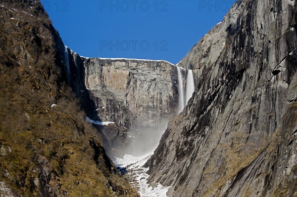 The magnificent Vedalsfoss, a steep waterfall in Hjolma Valley in Eidfjord, Hordaland, Norway.